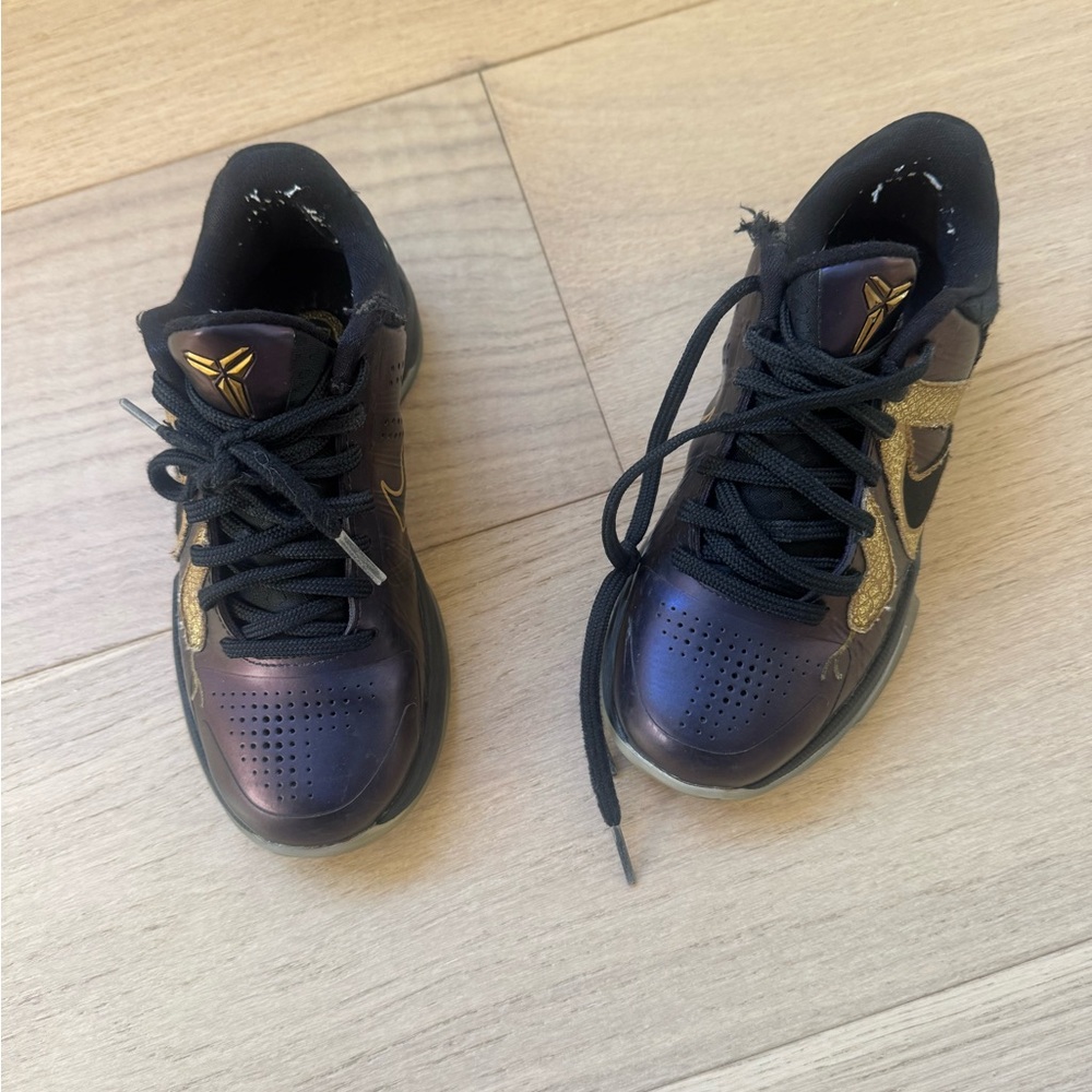 Kobe’s Black and Gold Athletic Shoes